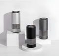 Compact aluminium alloy car air purifier in black, silver, or metallic grey for dashboard use.