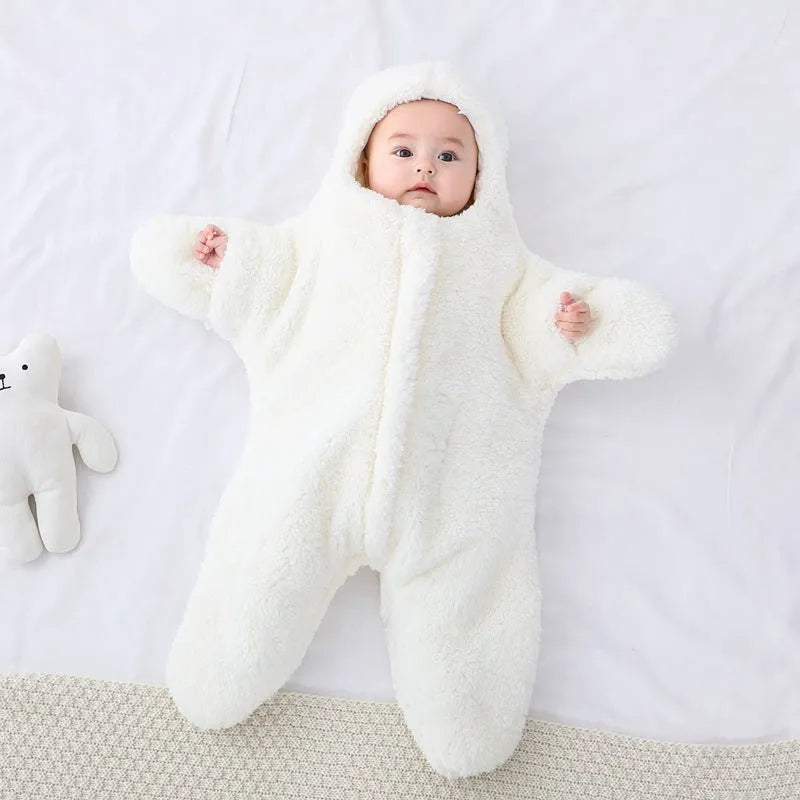 Baby lamb velvet starfish sleeping bag in khaki, hooded with zip and cuffs, lying flat on a surface