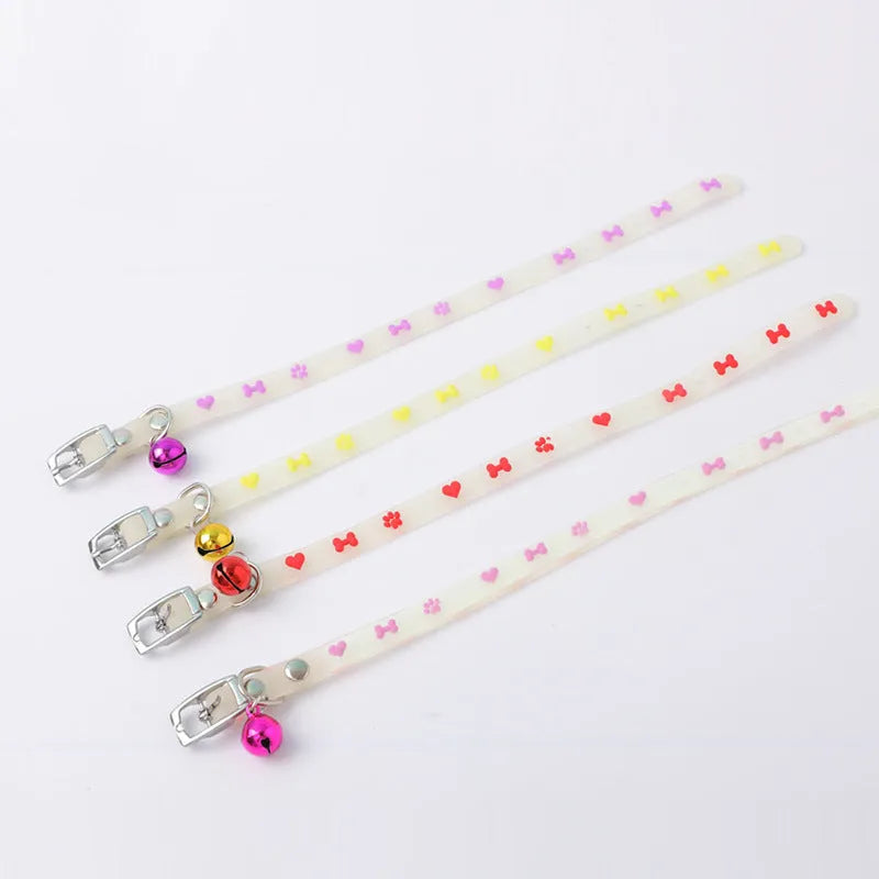 Cat wearing luminous collar with glow-in-the-dark paw print design on adjustable 29cm silicone chain