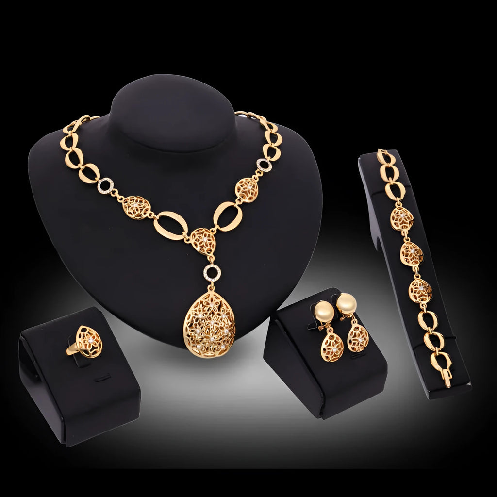 Gold alloy four piece jewellery set including necklace earrings bracelet and ring with bamboo link chain and love water drop bell patterns