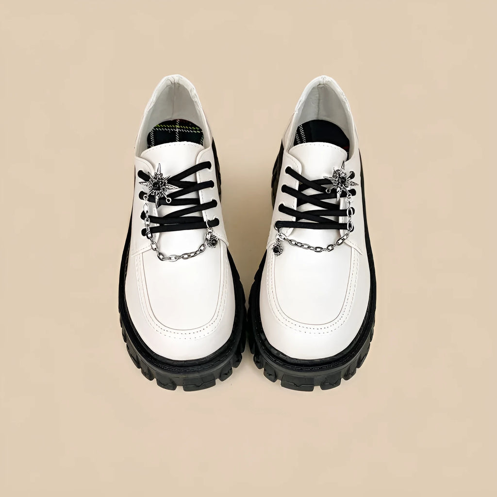 Women's Duke Asterism coloured loafers with a metal cross strap and round toe.
