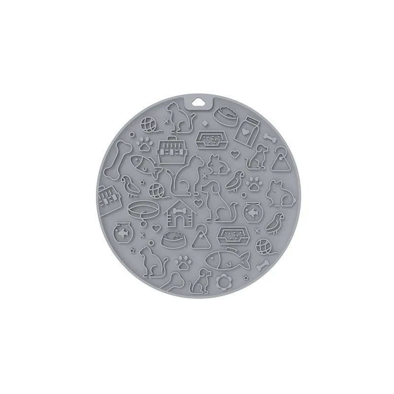 Round blue silicone pet licking mat with textured surface and white suction cup base