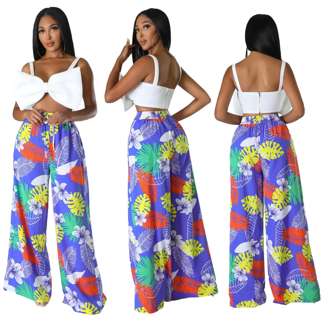 Women's high waist printed wide leg trousers in polyester fiber available in multiple colours