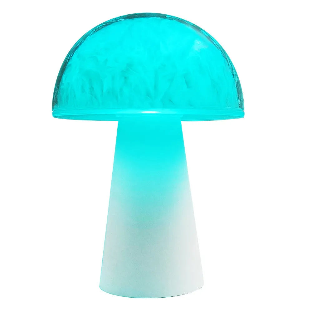 Small white mushroom-shaped night light with colourful RGB glow on a wooden table.