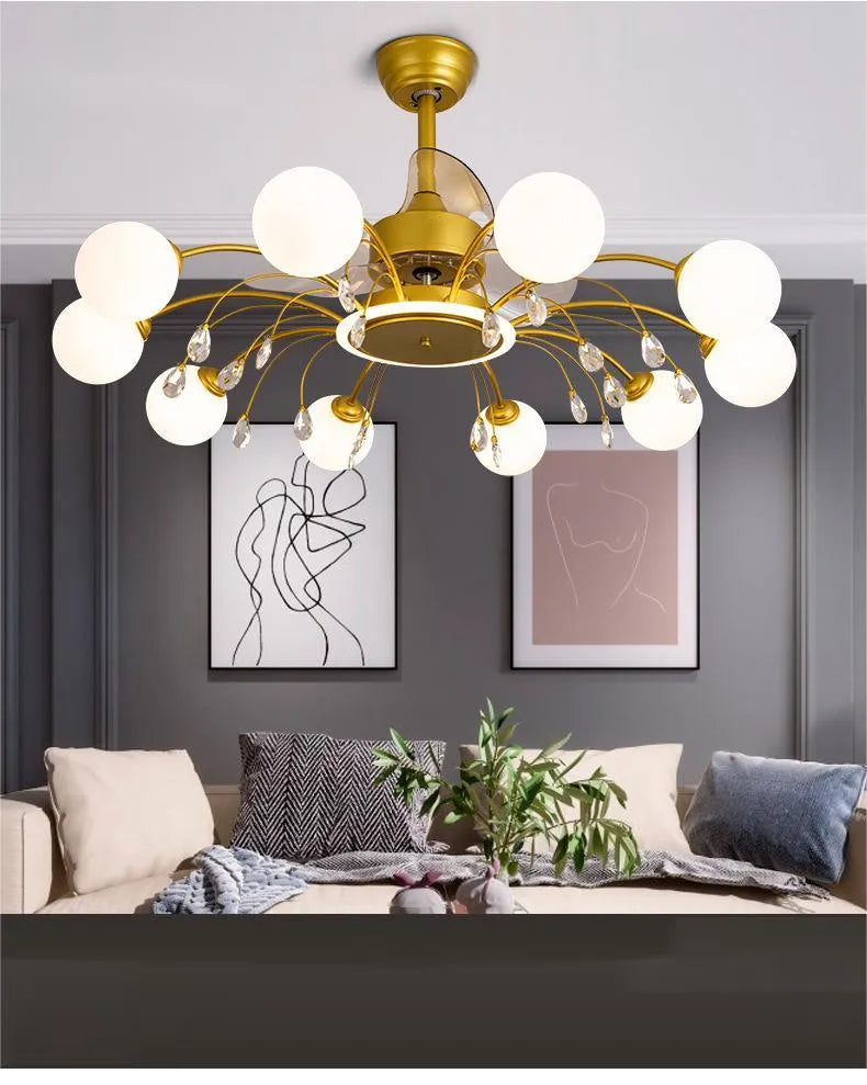 Gold finish ceiling fan chandelier with multiple lights and metal blades, shown on a white ceiling.