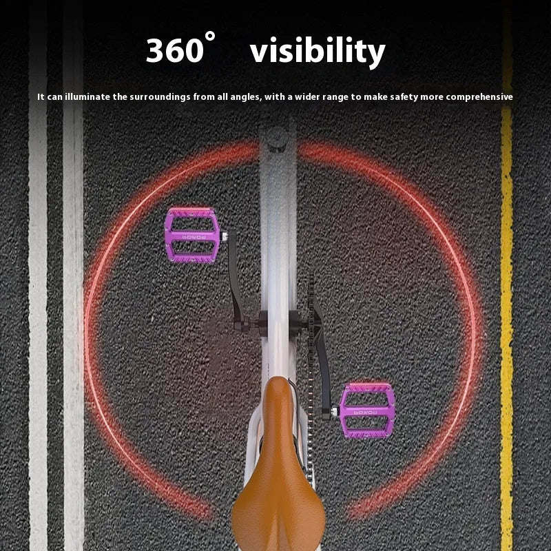 Pair of aluminium alloy bicycle pedals with integrated LED lights in multiple colour options.