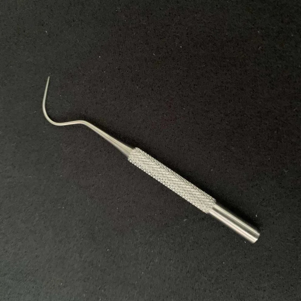7-piece 304 stainless steel toothpick set with dental floss in a white portable cylinder