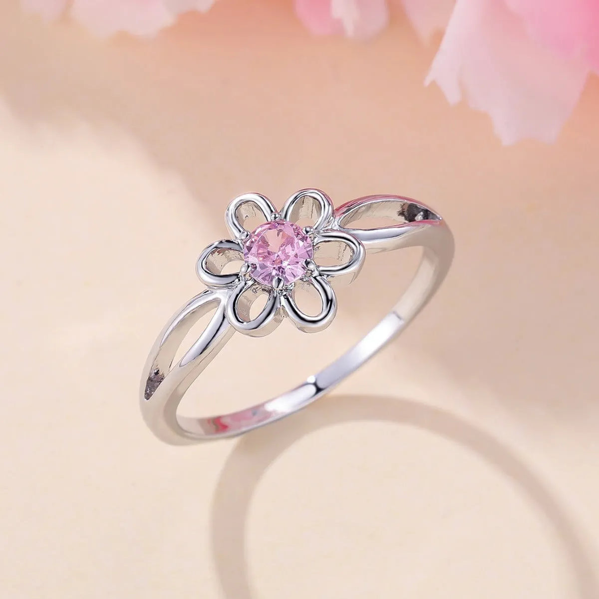 Copper flower hollow fashion ring with platinum pink diamond electroplated finish