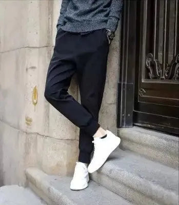 Black casual sports trousers with straight leg and tether closure, front view