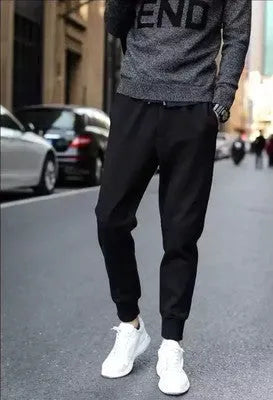 Black casual sports trousers with straight leg and tether closure, front view