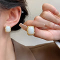 Circular geometric women's earrings with hand-woven mixed material construction in colour X0439