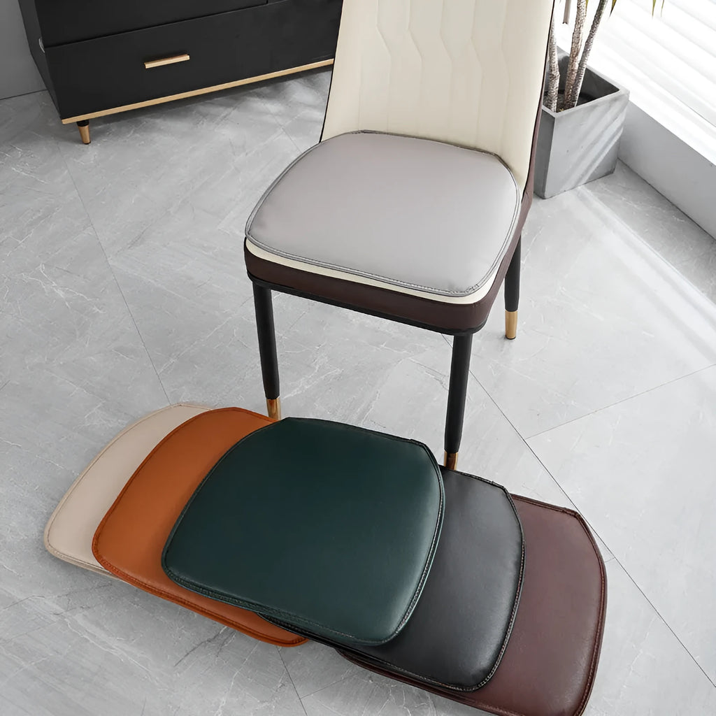 Leather horseshoe-shaped seat cushion in a solid colour showing its non-slip base and thickness.
