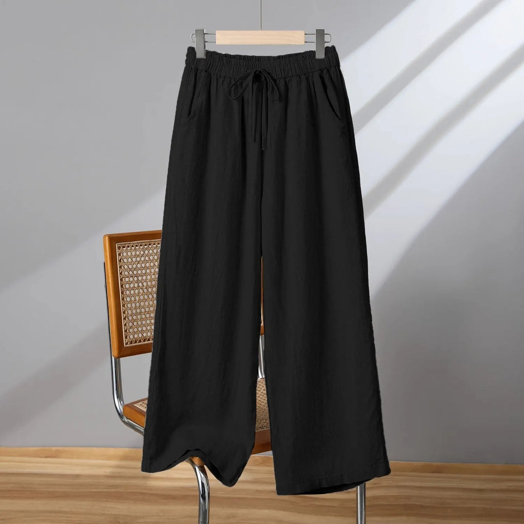 Women's straight leg casual trousers with a drawstring elastic waist in apricot colour.