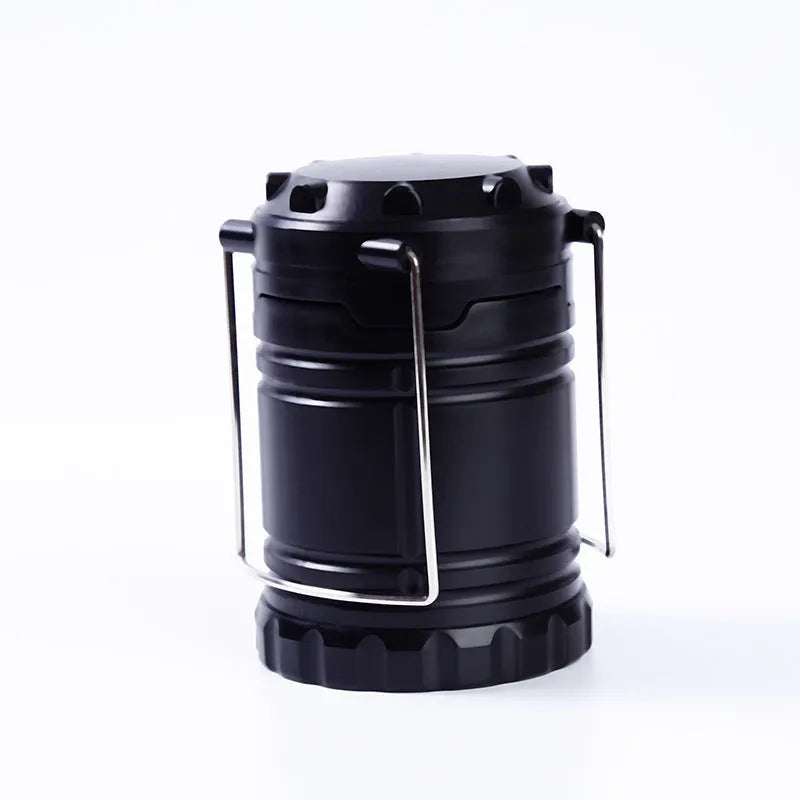 Gold multifunctional COB camping lantern with solar panel, telescopic design, and hook on a wooden table