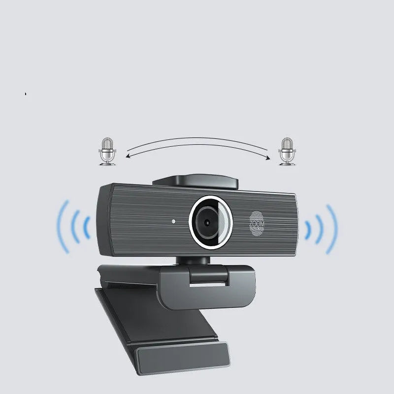 Black computer camera with magnetic privacy cover attached, showing USB cable connection