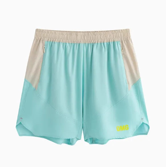 Man's loose grey workout shorts with elastic waist and lace-up fly, side view.