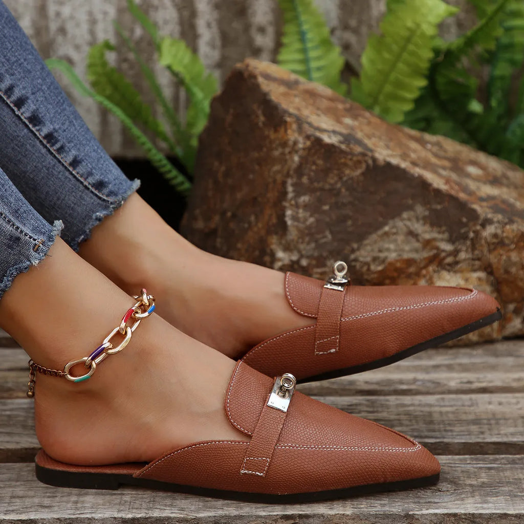 Light brown women's pointed-toe low heel semi-slippers with a rubber sole.