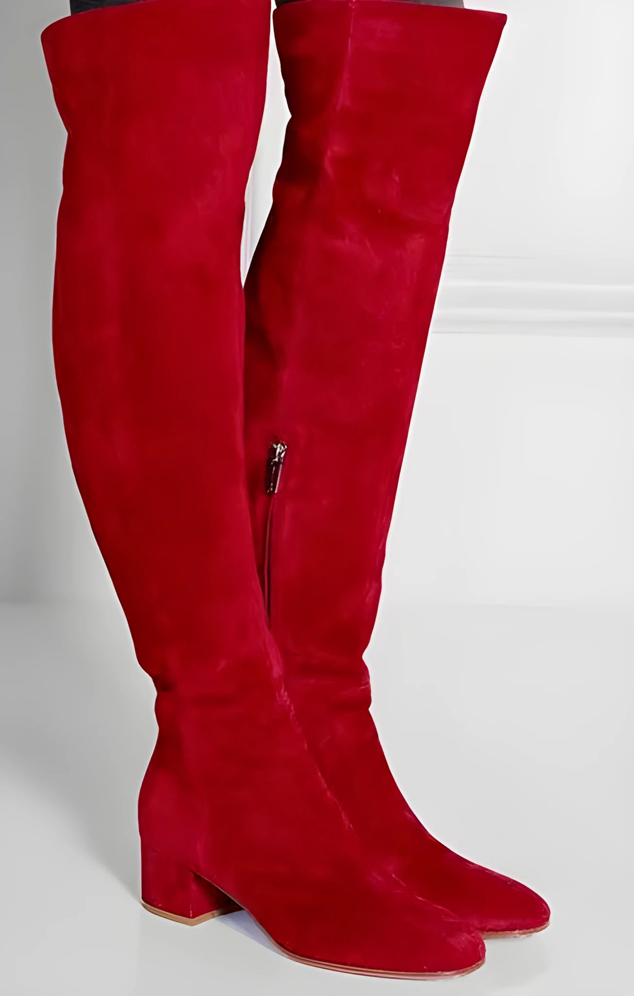 Grey women's suede over-the-knee flat boots with a pointed toe and low thick heel.