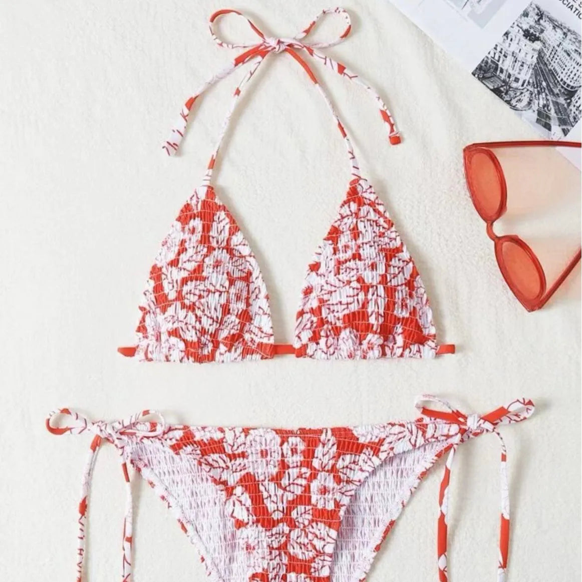 Women's floral halter neck two-piece swimsuit in briefs style, shown in light blue colour.