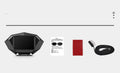 Black vehicle head-up display unit with LCD screen on a car dashboard.