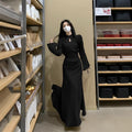 Plus size cheongsam dress in black with waist-tight draping effect and long sleeves