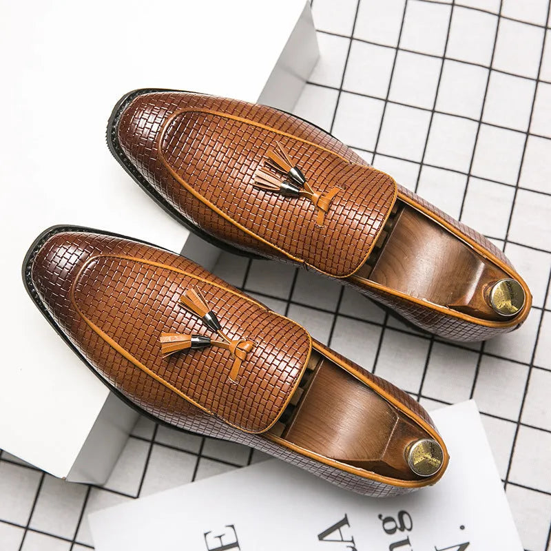 Men's black pointed toe slip-on loafers with a tassel detail on the artificial PU upper.