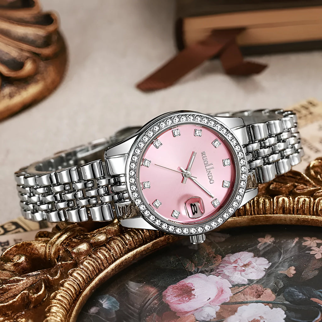 Women's silver alloy quartz watch with circular dial and stainless steel folding buckle on a wrist.