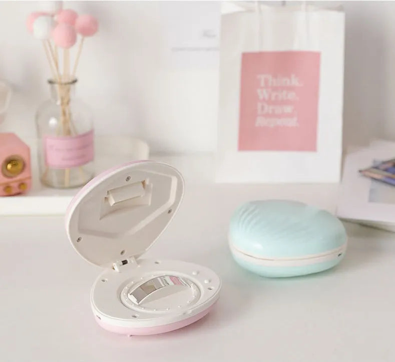 Shell rainbow projection light in blue or pink, ABS plastic, 130 x 118 x 54mm, USB 5V 1A, 1200mAh battery.