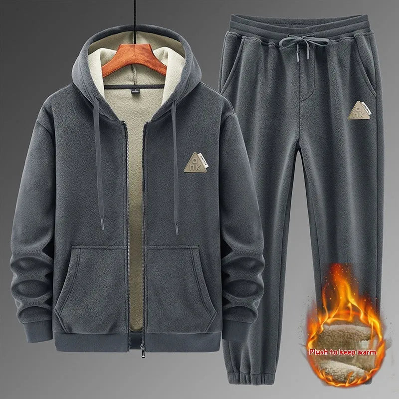 Grey casual sports suit set featuring a hooded long-sleeve sweater and matching trousers on a hanger.