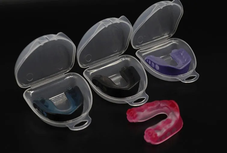 Silicone mouth guard in pink with transparent lockable storage box