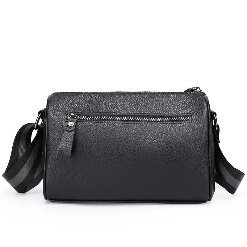 Black genuine leather one-shoulder crossbody bag showing its size and style.