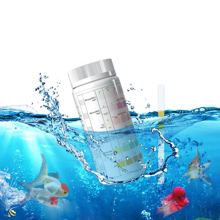 Six-in-one aquarium water quality test paper on a white surface, showing colour pads for total hardness, nitrate, nitrite, chlorine, carbonates, and pH testing