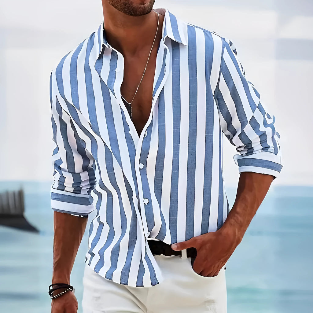 Man wearing a loose grey striped long-sleeved casual shirt with a cardigan style.