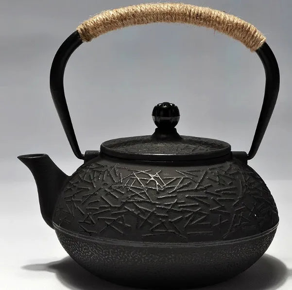 Japanese style cast iron teapot with 0.9 litre capacity shown in a bronze finish.