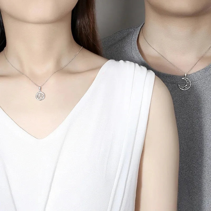 Sun and moon couple necklace with copper pendant on cross chain, showing male and female colour options