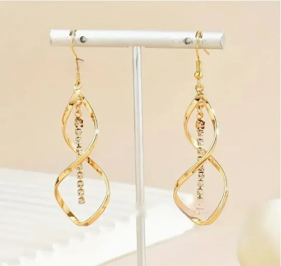 Gold geometric spiral drop earrings with oval detailing for women