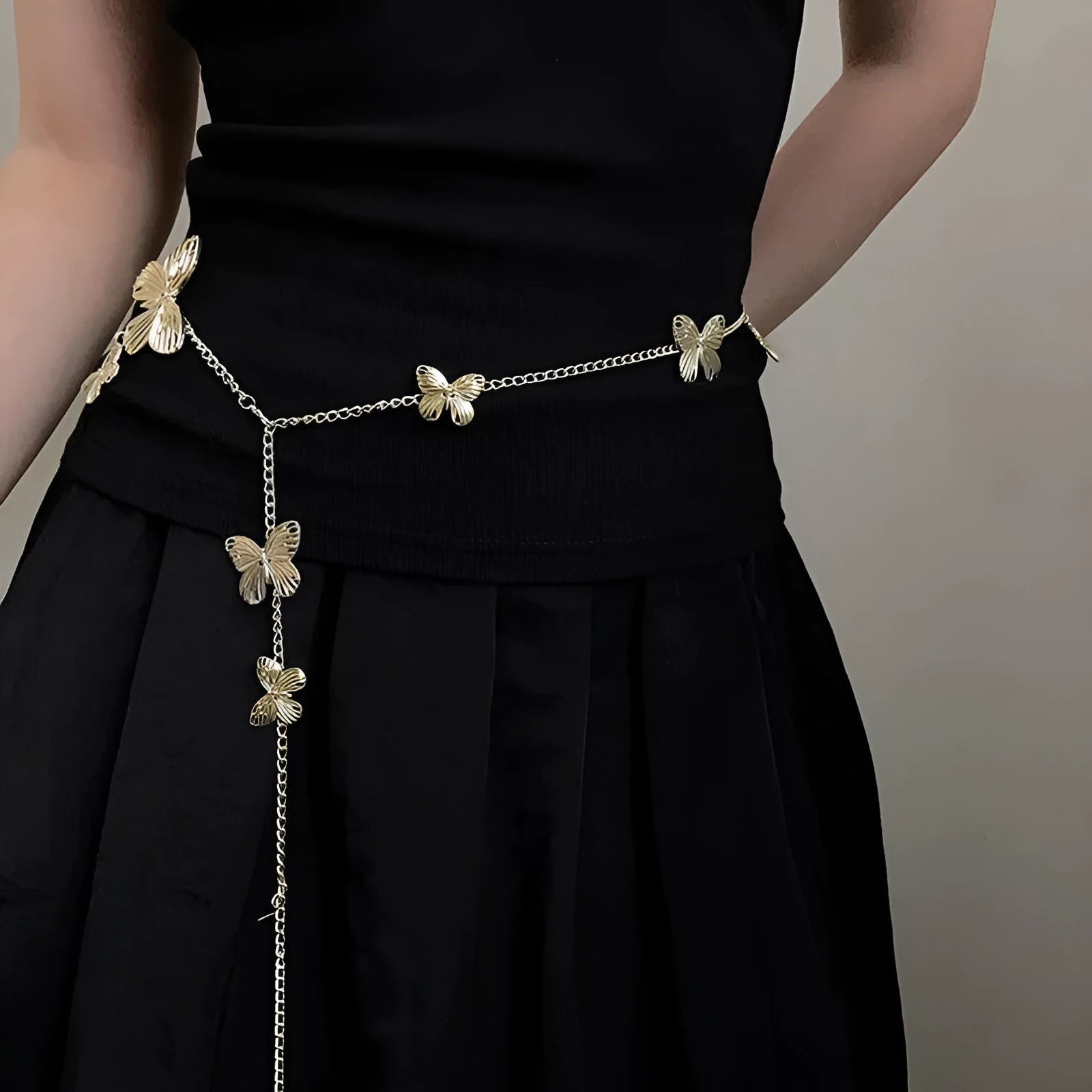 Women's alloy waist chain with butterfly charm in gold or silver colour, 104cm length