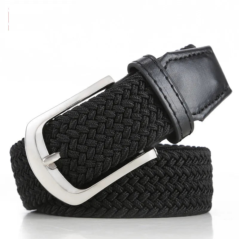 Unisex braided elasticated canvas belt in beige with alloy buckle, shown on a wooden surface