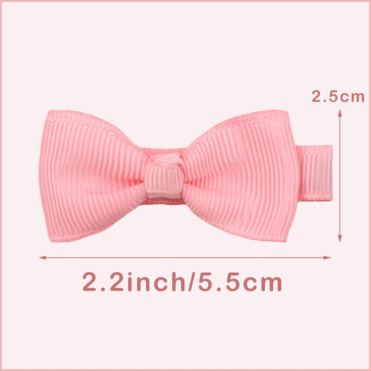 Set of pastel coloured baby hair clips including barrettes and bows on a white background