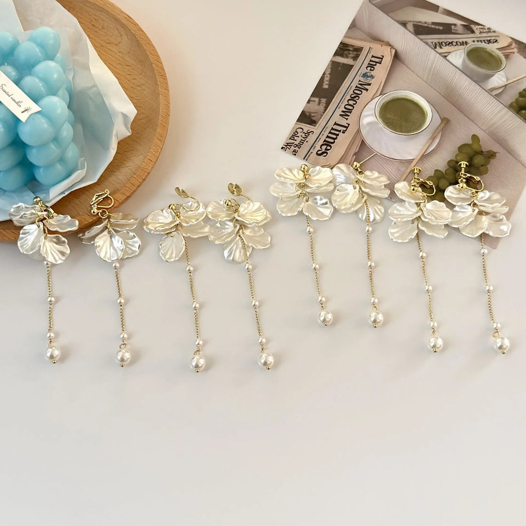 Women's acrylic shell pearl tassel earrings showing 8.8cm length and tassel design