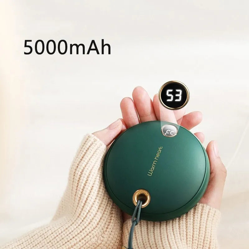 Green Pink or White coloured 5000mAh hand warmer power bank with digital display showing charge level.
