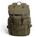 Canvas casual backpack with crazy horse leather trim in brown side view showing main compartment and shoulder strap