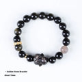 Handmade national style bracelet with a lying rabbit charm, grey agate, and metal details on a wrist.