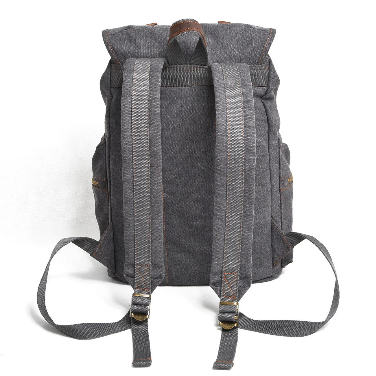 Canvas casual backpack with crazy horse leather trim in brown side view showing main compartment and shoulder strap