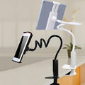 Flexible mount holder with suction base holding a phone at adjustable angle