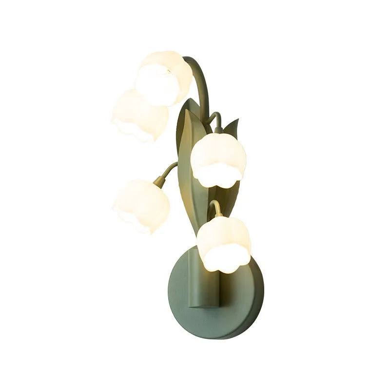 Modern minimalist French pastoral wall lamp with a green tricolour light and white PC shade mounted on a bedroom wall.