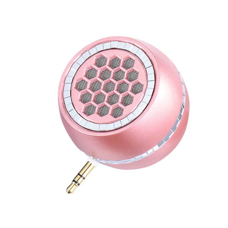 Black universal external amplifier speaker with a single channel, powered by a 5V mobile phone charger.