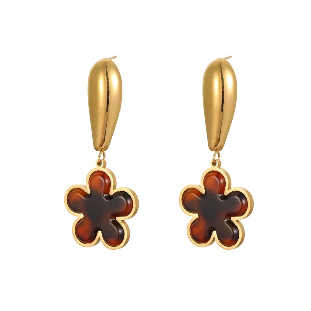 Gold electroplated tortoiseshell resin earrings in heart and flower designs on stainless steel