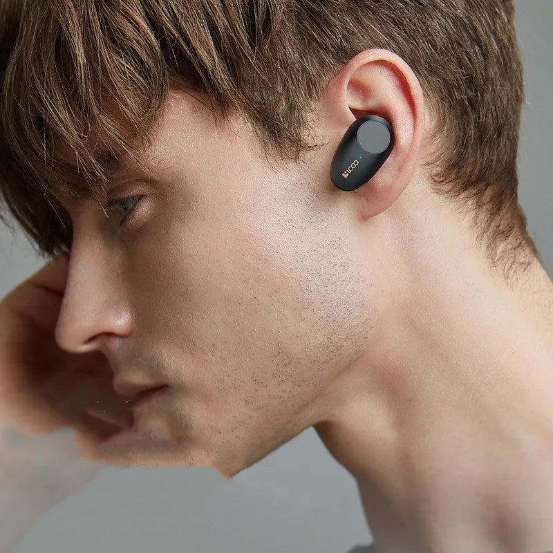 Black wireless Bluetooth earbuds with charging stand featuring ANC and 10m range.