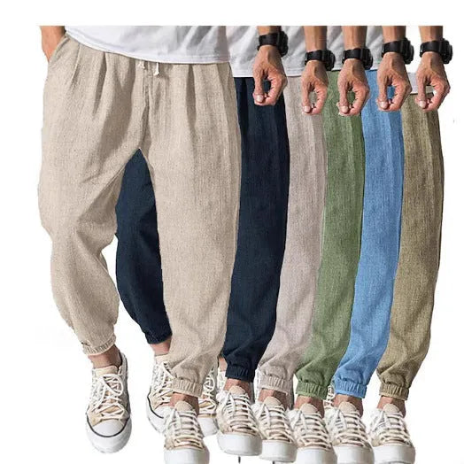 Man wearing light-coloured cotton banded ankle pants with a loose, casual fit.